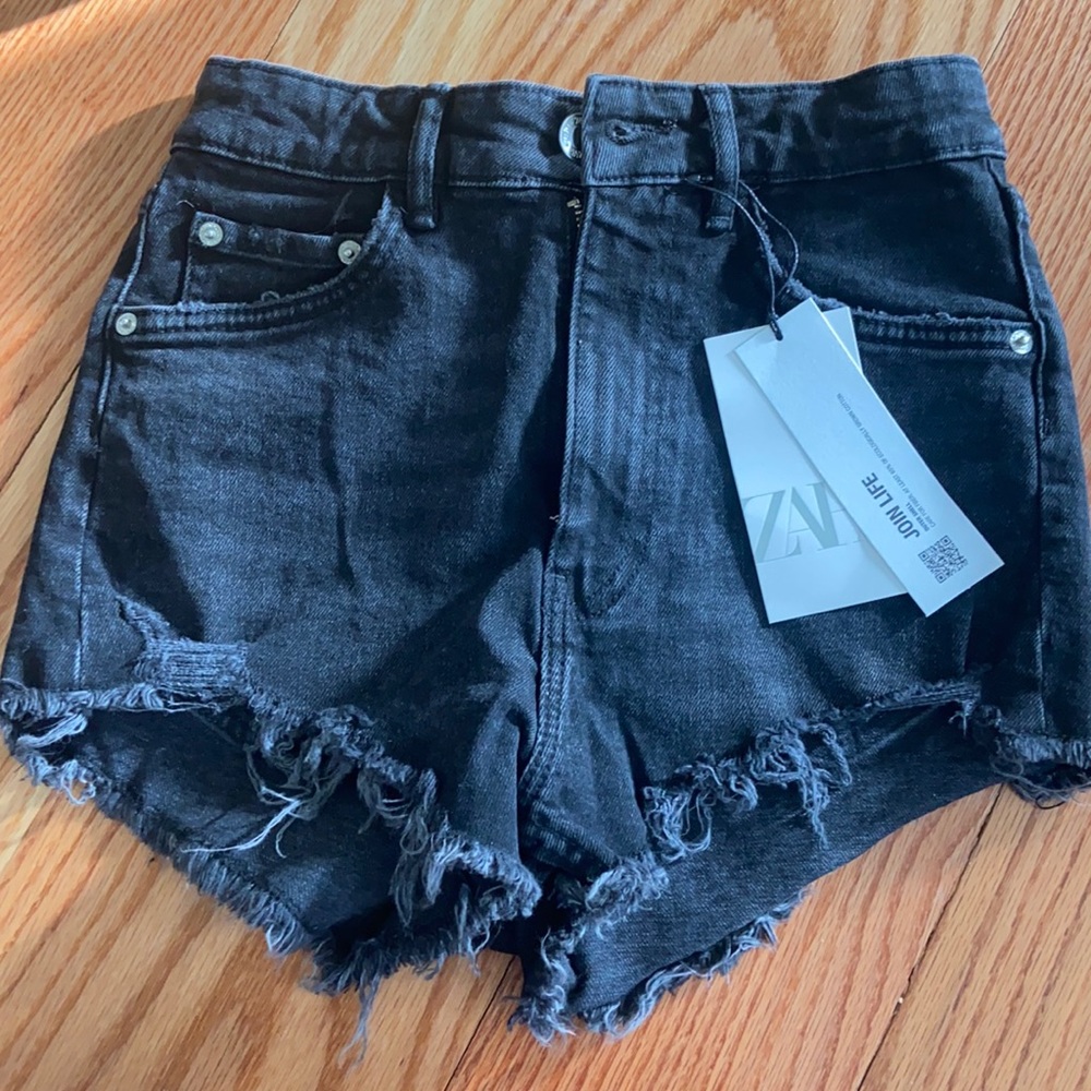 Distressed black denim shorts
